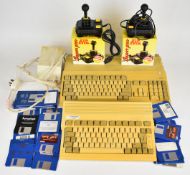 Two Commodore Amiga home computers comprising A500 and A600 together with one power supply, two