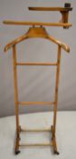 Vintage valet stand raised on four castors, height 122cm