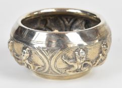 Indian, Burmese or similar silver bowl, embossed with a series of panels depicting a story of two