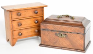 Apprentice or miniature chest of three drawers, length 22cm, and a Georgian mahogany tea caddy