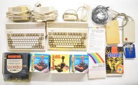 Two Commodore Amiga A600 home computers together with power supplies, disk drives, joysticks and