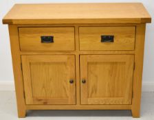 Modern oak sideboard with two drawers above cupboard doors with two shelves within, W105 x D45 x