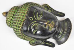 Six bronze or carved busts of Buddha and a twin handled bronze dish, tallest 13cm