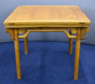 19thC Chinese jointed elm table with moulded supports, raised on four circular legs, W91 x D92 x