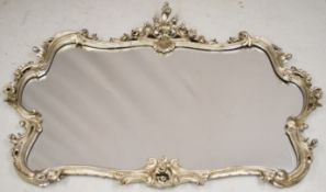 Ornate bevelled glass hanging mirror with silvered frame, 103 x132cm