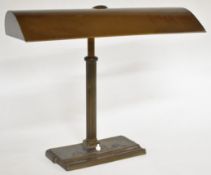Bronze desk or library lamp with reeded column and aerofoil section shade, overall width 46cm