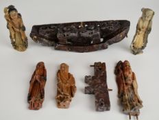 Four Chinese soapstone figures with stands