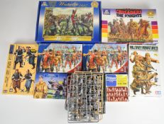 A collection of plastic model soldier kits by Tamiya, Italeri, Preiser and Perry Miniatures to