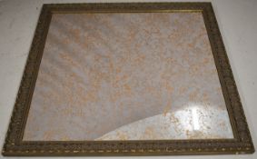 Large mirror with moulded frame and distressed glass, 136 x 147cm