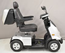 TGA Breeze midi mobility scooter with storage box and charger, possibly never / little used. The
