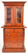 Apprentice or miniature novelty mahogany bookcase with twin glazed doors to top and four graduated