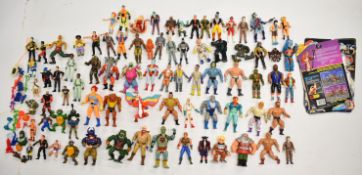 A collection of 1980's/90's action figures to include Masters of the Universe, The Real