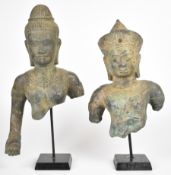 Two bronze busts of Khmer queens/deities, on stands, tallest 44cm