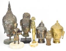 A collection of bronze Buddha heads, European brass figures, 18th/19thC bronze covered vessel with