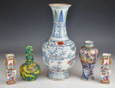 Five Chinese and Japanese vases including including clobbered vase with blue and yellow decoration