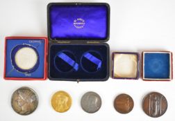 Duke and Duchess of York, a cased pair of medals in silver and gilt issued to commemorate their