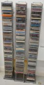 Three vintage stainless steel CD storage towers each capable of holding approximately seventy CDs