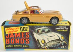 Corgi Toys diecast model James Bond 007 Aston Martin DB5 with gold body, red interior, opening