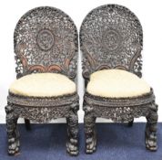 Pair of 19th century Anglo Indian Bombay Blackwood or padauk carved chairs with carved foliate