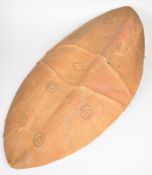 Elliptical leather covered tribal shield with embossed circular patterns, by repute a Zulu Dawn (