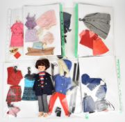 Pedigree Sindy doll with a collection of vintage outfits including Air Hostess, Winter Holiday,