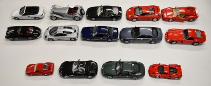 Fourteen mostly 1:18 scale die cast model sports cars to include BMW 325i, Ferrari GTO, Jaguar SS