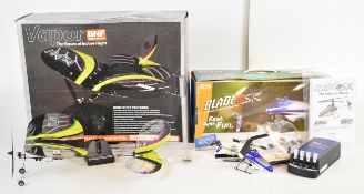 Two Bind-N-Fly (BNF) radio controlled micro flyers comprising Blade MSR and Vapor, both in