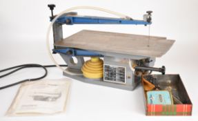Hegner fretsaw with replacement steel table added by the vendor for cutting metal so the swarf
