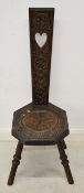 Carved oak spinning chair, H94cm