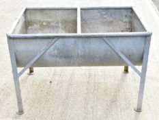 Galvanised twin bay feed trough with drainage holes suitable for use as a garden planter, W110 x D66