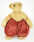 Merrythought 'Dutch Boy' style Teddy bear with golden plush, orange/black glass eyes and felt pads