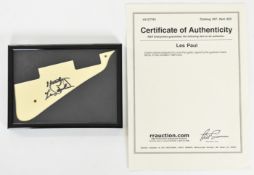 (Les Paul) Cream coloured pickguard from a Les Paul guitar, with 'Les Paul' signature and