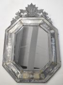 19thC Venetian bevelled and engraved cushion mirror with scrolling finial, W115 x H121cm Provenance: