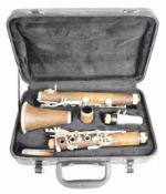 Wooden clarinet marked Rhapsody, E0546D, in fitted case.