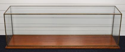 Glazed display case with brass frame and wooden base, to suit live steam locomotive, traction engine