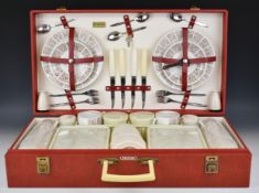 Four person Brexton picnic hamper or case with patterned red exterior, opening to reveal twin