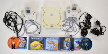 Sega Dreamcast retro games console with two controllers and five games.