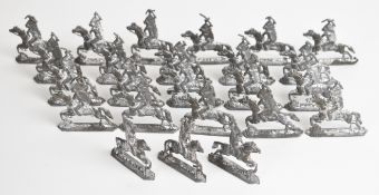 Twenty four vintage Native American Indian lead or white metal toy soldiers.