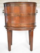 19th/20th coopered mahogany oval cellarette raised on square tapering legs, W63 x H87cm