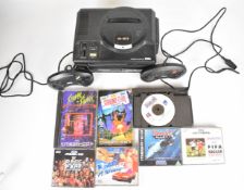 Sega Mega Drive with Mega-CD 1 attachment, two controllers and six games comprising WWF Rage in