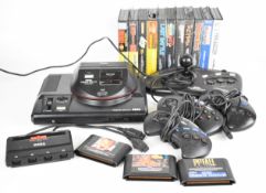Sega Mega Drive games console with Master System converter, three controllers, arcade power stick,