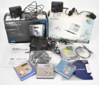 Three Sony Mini Disc Walkmans comprising models MZ-NH700, MZ-505 and MZ-N510, together with