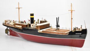 Live steam model cargo ship with fibreglass hull and metal and wooden superstructure and