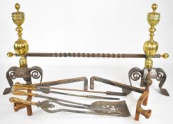 Pair of 19thC brass and wrought iron fire dogs, associated ironwork and companion set