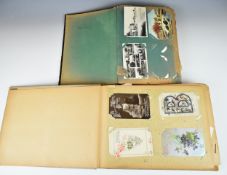 Collection of almost five hundred Edwardian and early 20th century postcards housed in two albums,