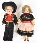 Two Armand Marseille miniature bisque headed dolls, both marked A1210M and in traditional dress with