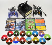 Nintendo Game Cube retro games console with power supply, three controllers and eighteen loose and