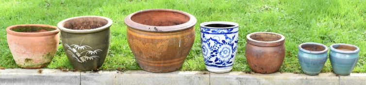Group of seven jardinieres / garden planters comprising one decorated with a dragon motif, another