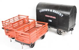 Four 5 inch gauge Ffestiniog slate and similar wagons with curved spoked wheels, two with wooden