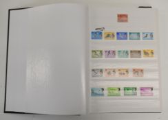Stockbook with Queen Elizabeth II Commonwealth stamps together with various foreign stamps including